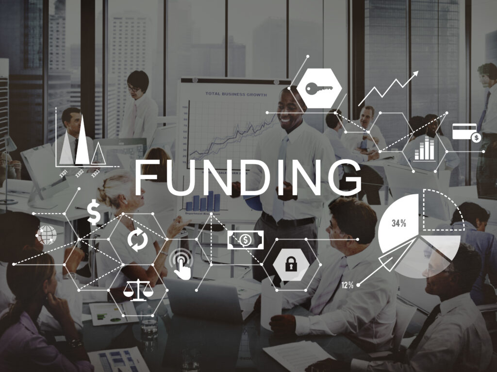 Funding preparedness in business meeting with financial charts and team collaboration